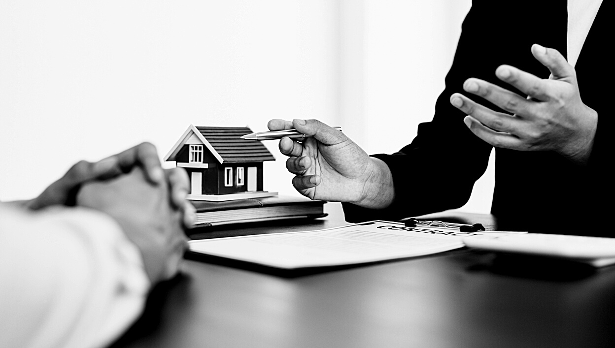 Real Estate Agent Showing Contract to Client